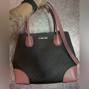 Michael kors bag with matching strap.